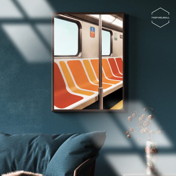 An empty subway car with vibrant orange and red striped seats. Sunlight streams in through the window, casting a warm glow on the interior.